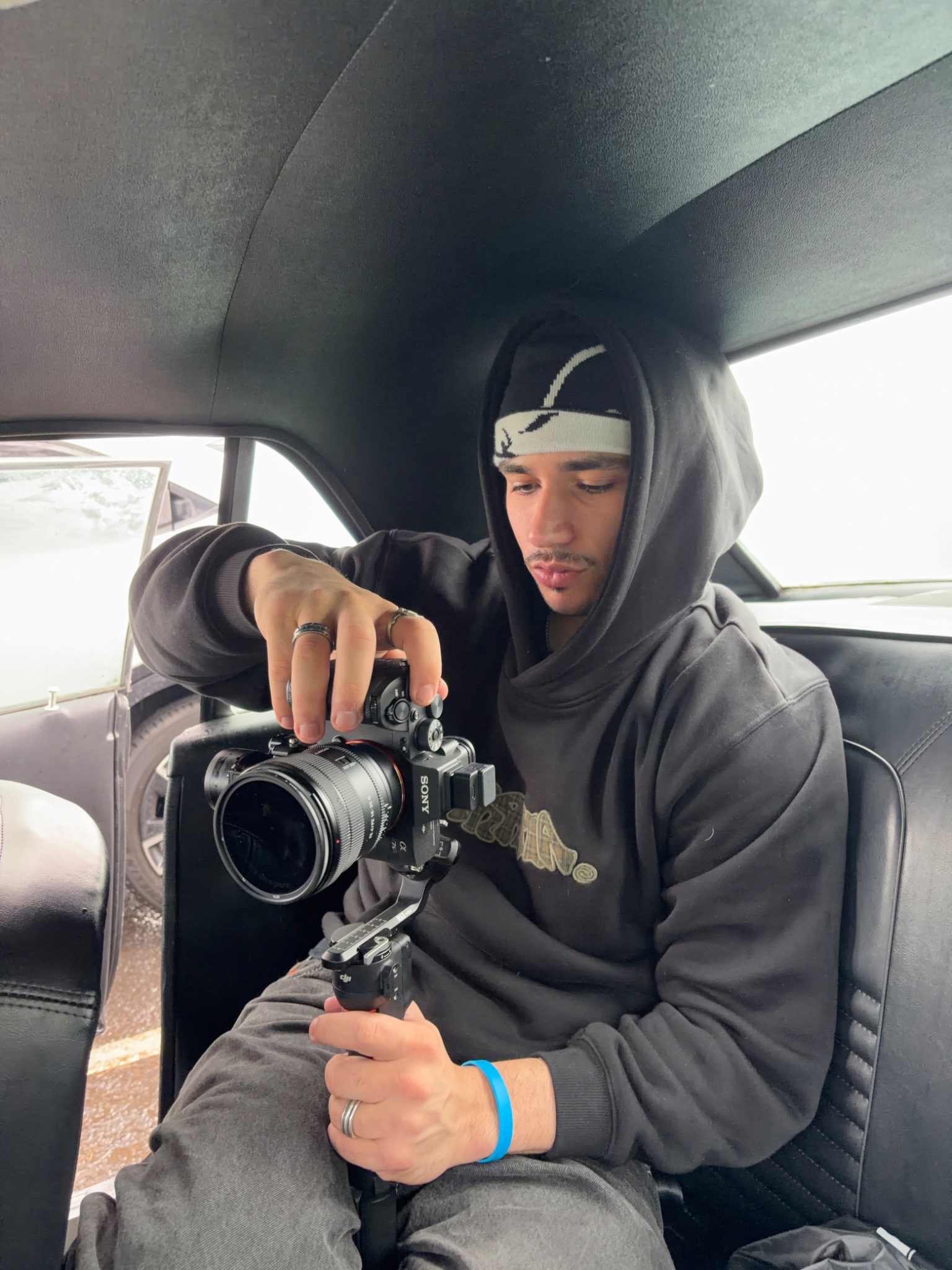 Logan holding a Sony camera